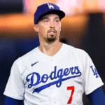 Dodgers starting pitcher Tony Gonsolin wipes his head as he walks off the field after giving up three runs in the top of the first inning of their 6-1 loss to the New York Mets on Wednesday night at Dodger Stadium.