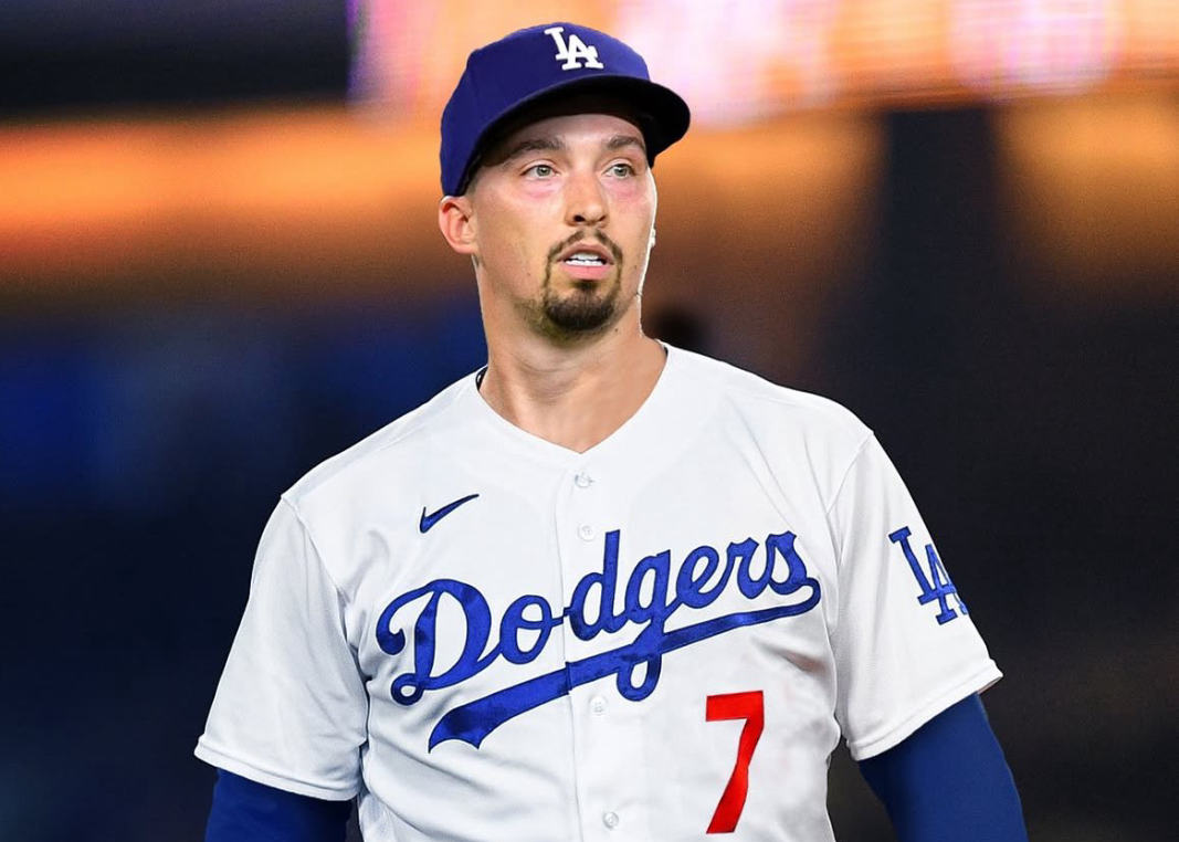 Dodgers starting pitcher Tony Gonsolin wipes his head as he walks off the field after giving up three runs in the top of the first inning of their 6-1 loss to the New York Mets on Wednesday night at Dodger Stadium.